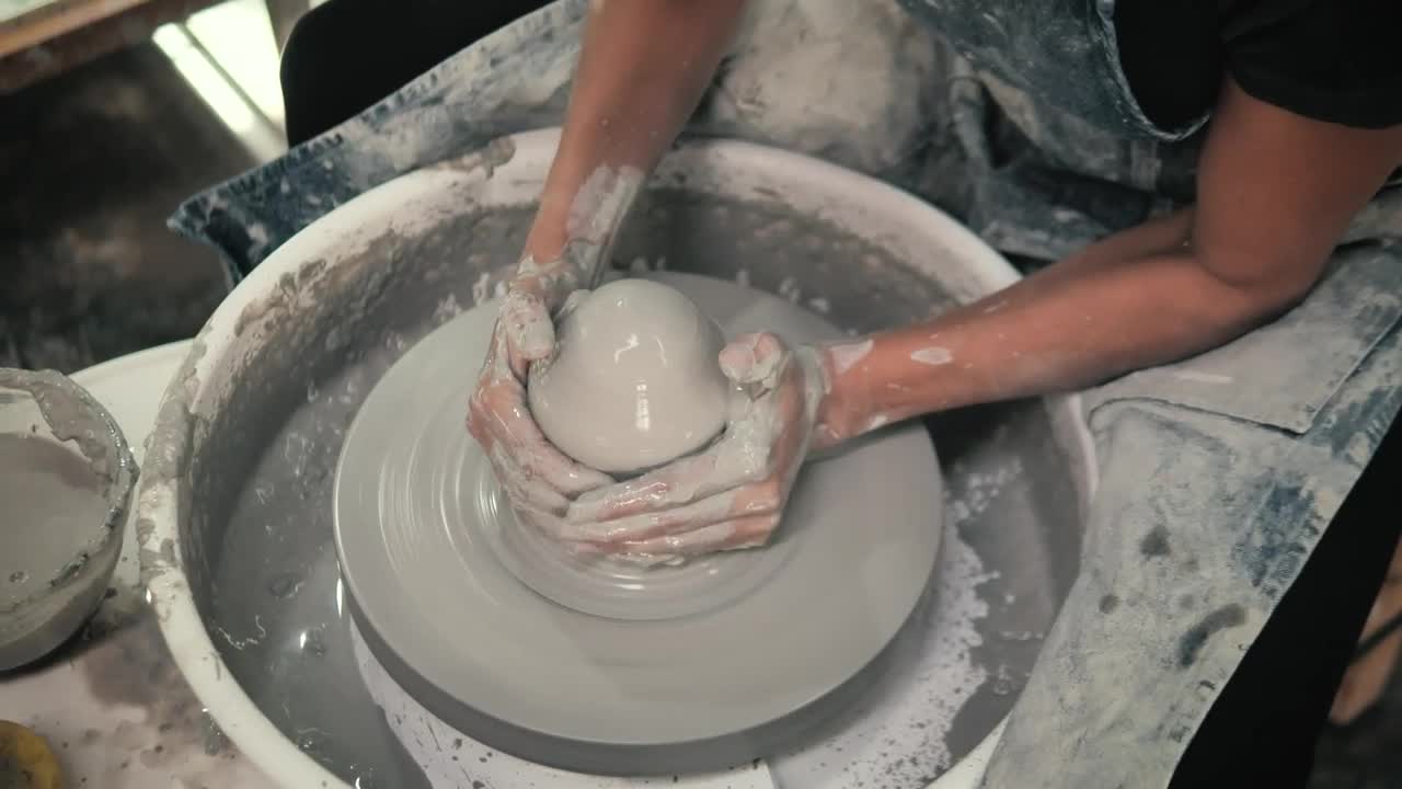 Download Stock Video A Ceramic Artist Modeling Pottery Live Wallpaper for PC