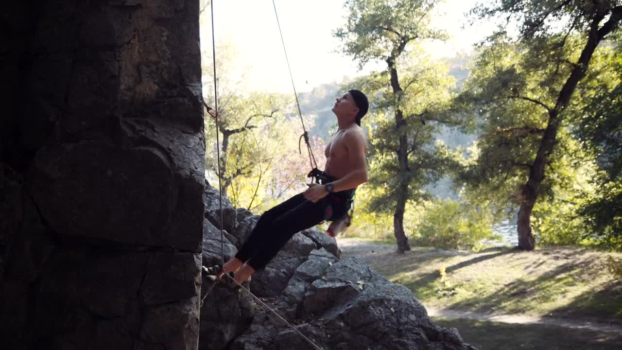 Download Stock Video A Climber Testing The Ropes On The Rock Live Wallpaper for PC