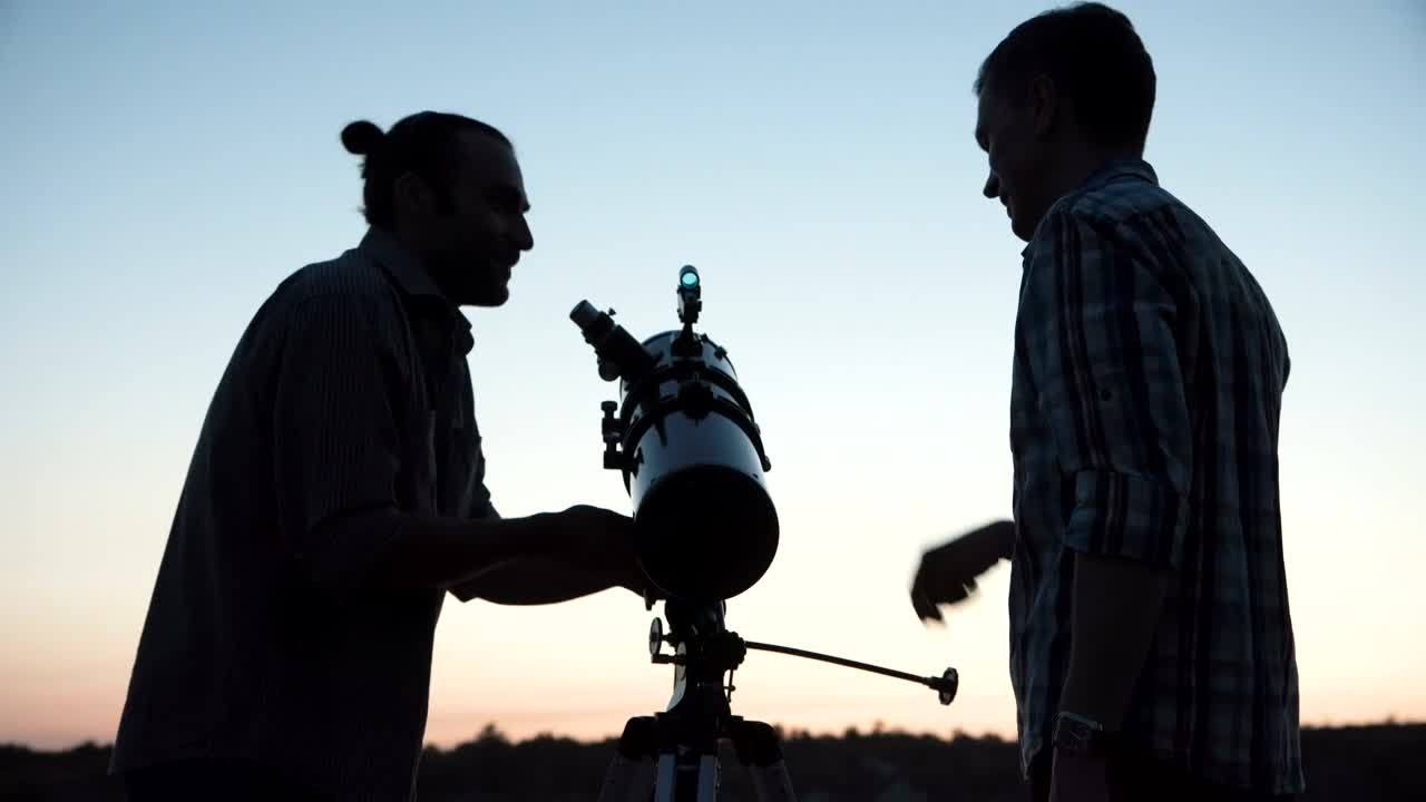 Download Stock Video A Couple Of Man Using A Telescope At Dawn Live Wallpaper for PC