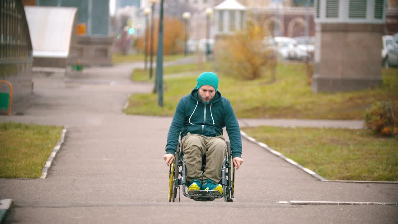 Download Stock Video A Disabled Man Makes Failed Attempt To Steer His Wheelchair Live Wallpaper for PC