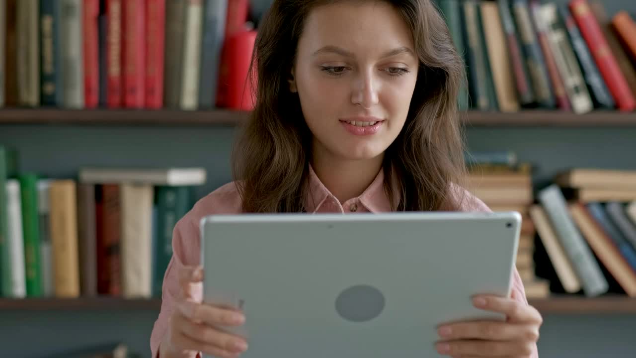 Download Stock Video Academic Studying With A Tablet At The University Library Live Wallpaper for PC