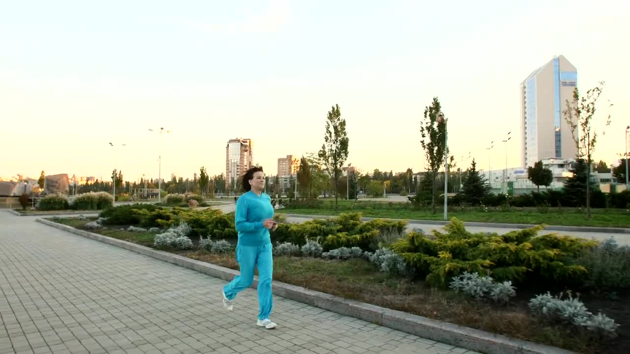 Download Stock Video Adult Woman Jogging Through A Large Garden  Larg Live Wallpaper for PC