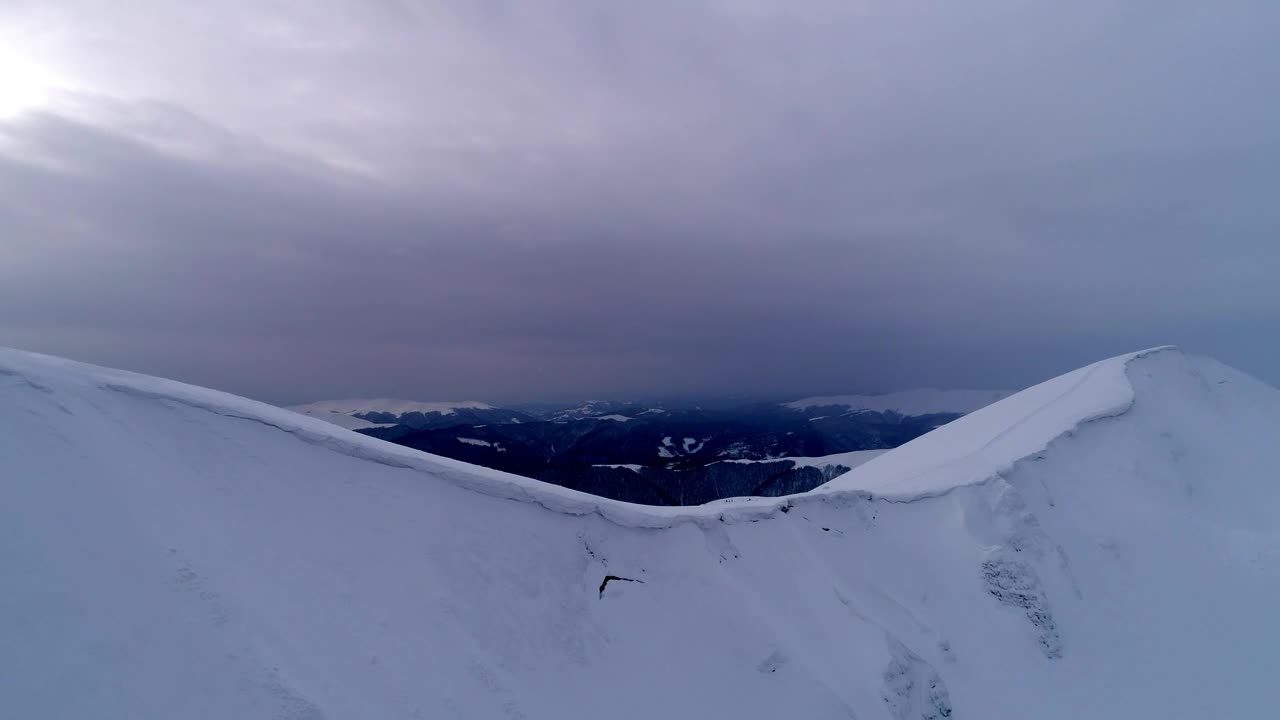 Download Stock Video Aerial Shot Of The Top Of A Snow Covered Mountain Live Wallpaper for PC