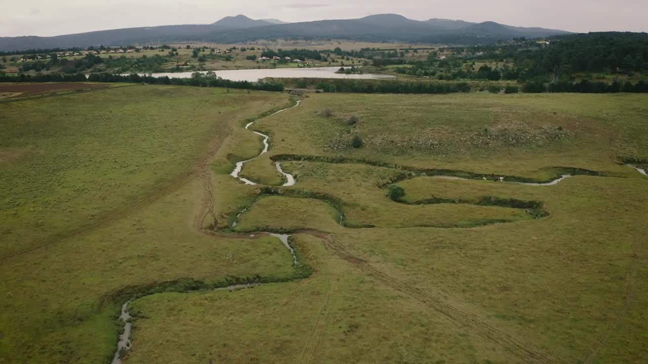 Download Stock Video Aerial View Of A Green Field With Rivers Live Wallpaper for PC