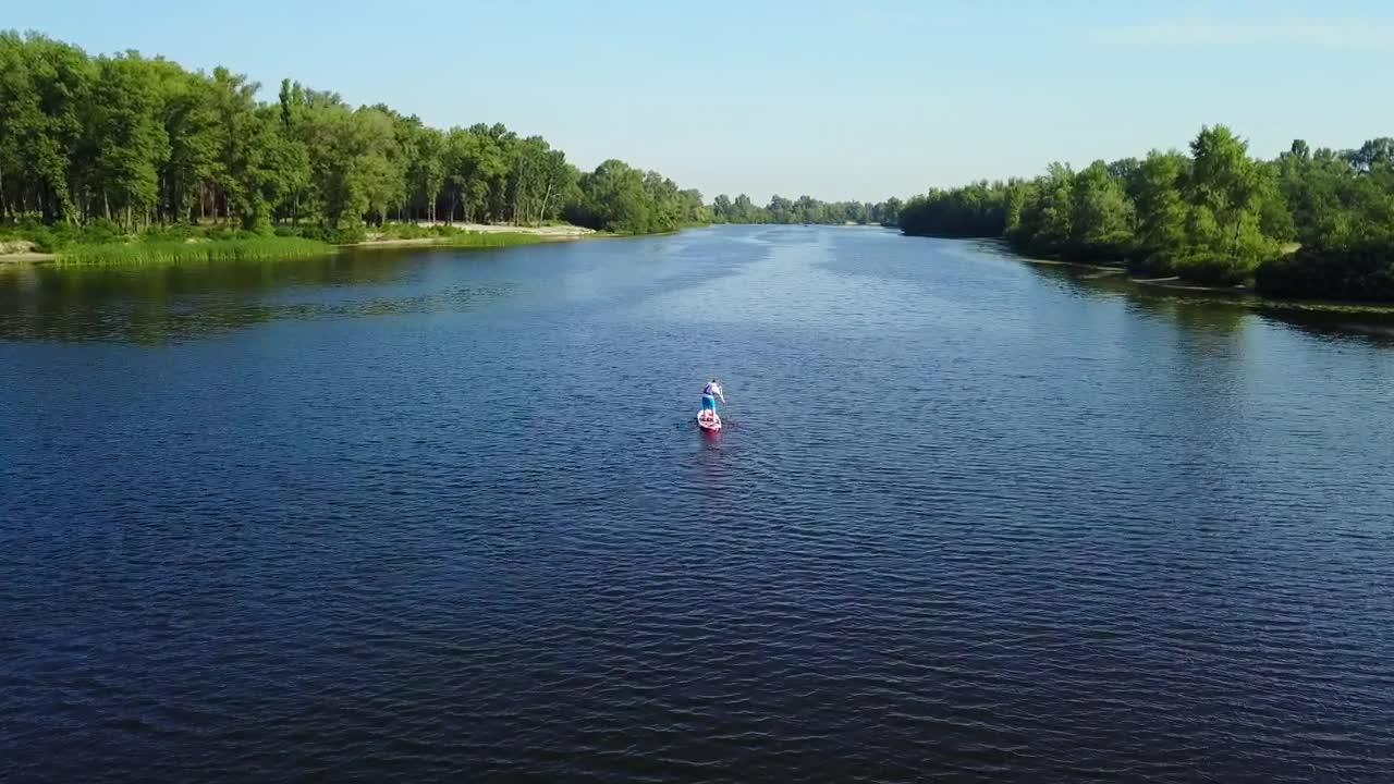 Download Stock Video Aerial View Of Man On Paddle Board In River Live Wallpaper for PC