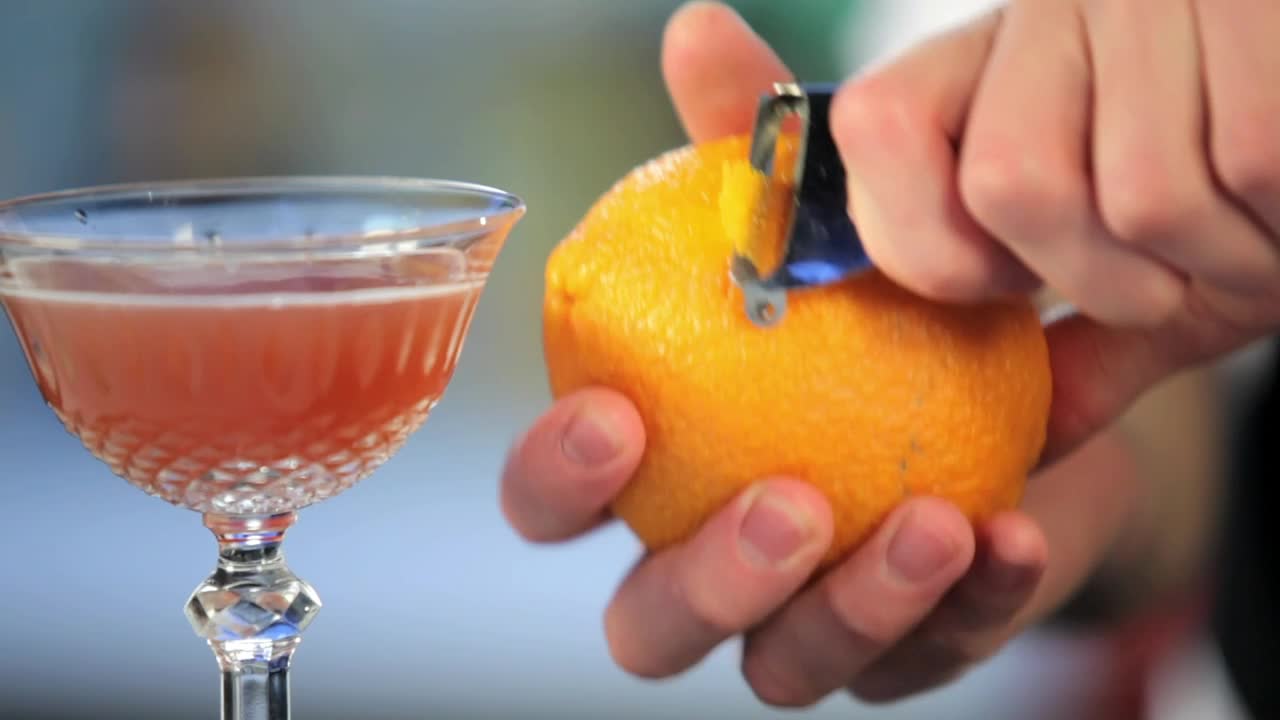 Download Stock Video Barman Preparing An Orange Cocktail Live Wallpaper For PC