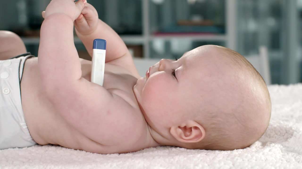 Download Stock Video Baby Lying With A Thermometer In His Arm Live Wallpaper For PC