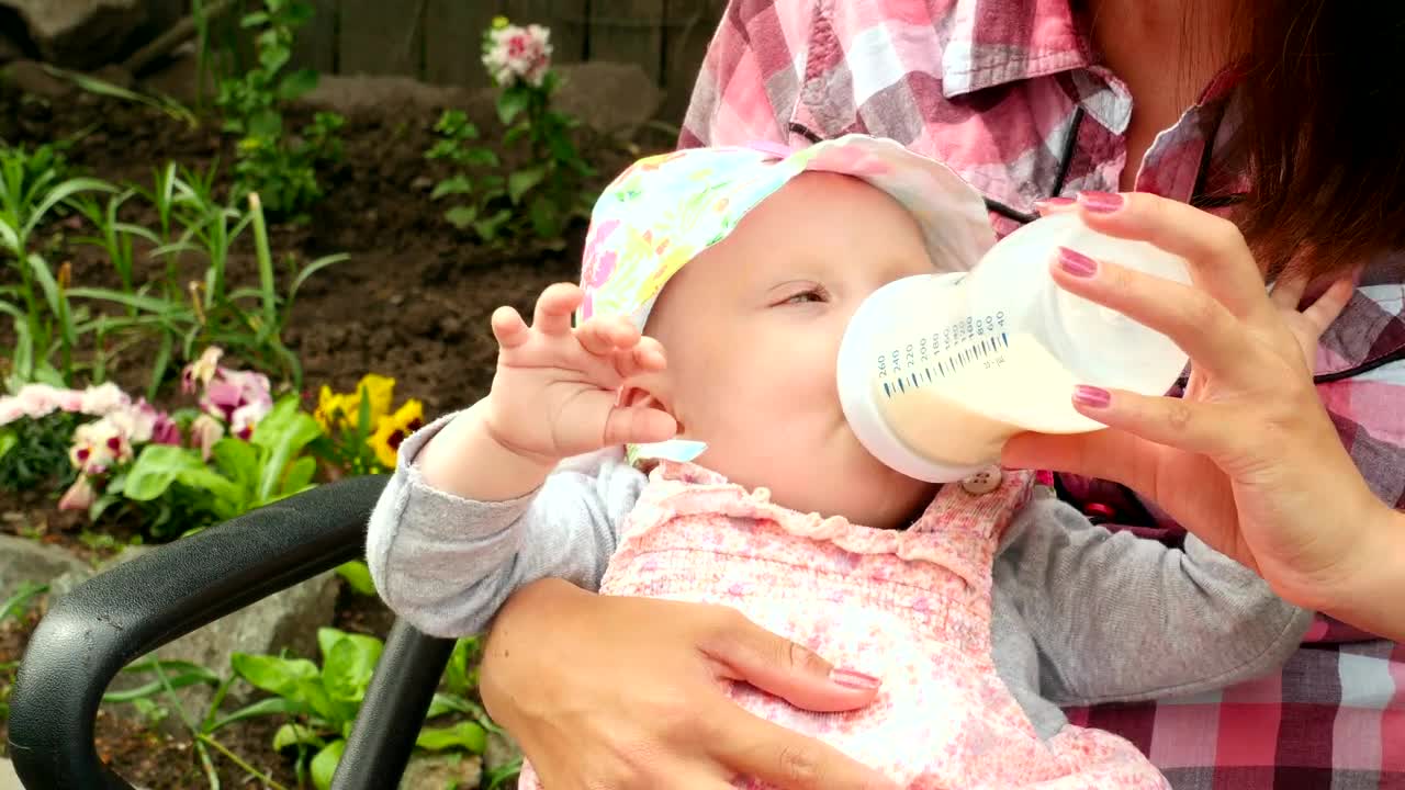 Download Stock Video Baby Girl Drinking Milk From A Baby Bottle Live Wallpaper For PC