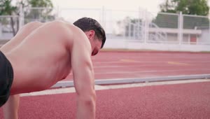 Download Stock Video Athletic Man Doing Push Ups On A Running Track Live Wallpaper For PC