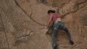 Download Stock Video Athletic Female Mountaineer Climbing A Rocky Mountain Live Wallpaper For PC