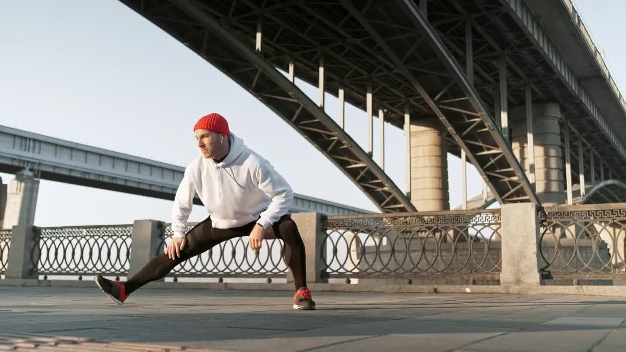 Download Stock Video Athlete Stretching His Legs In The Street Live Wallpaper For PC