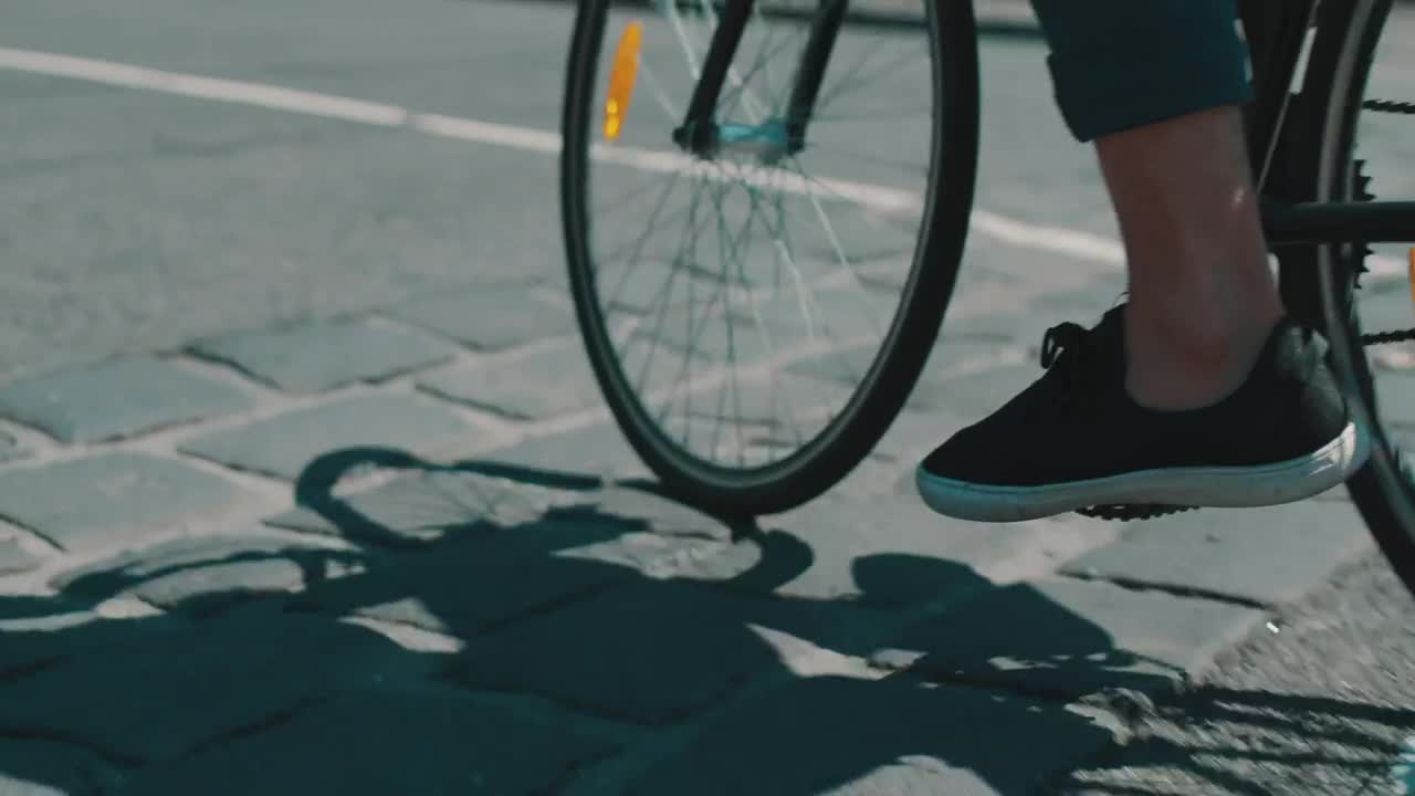 Download Stock Video An Urban Cyclist And His Shadow In The Road Live Wallpaper For PC