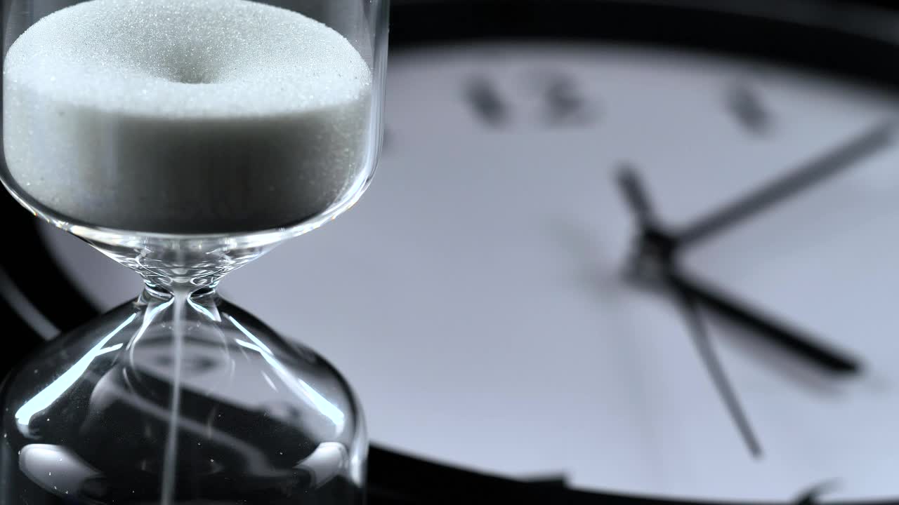 Download Stock Video An Hourglass And An Analog Wall Clock Live Wallpaper For PC