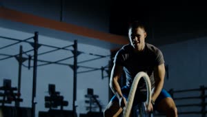 Download Stock Video An Athlete Using Thew Ropes In The Gym Live Wallpaper For PC