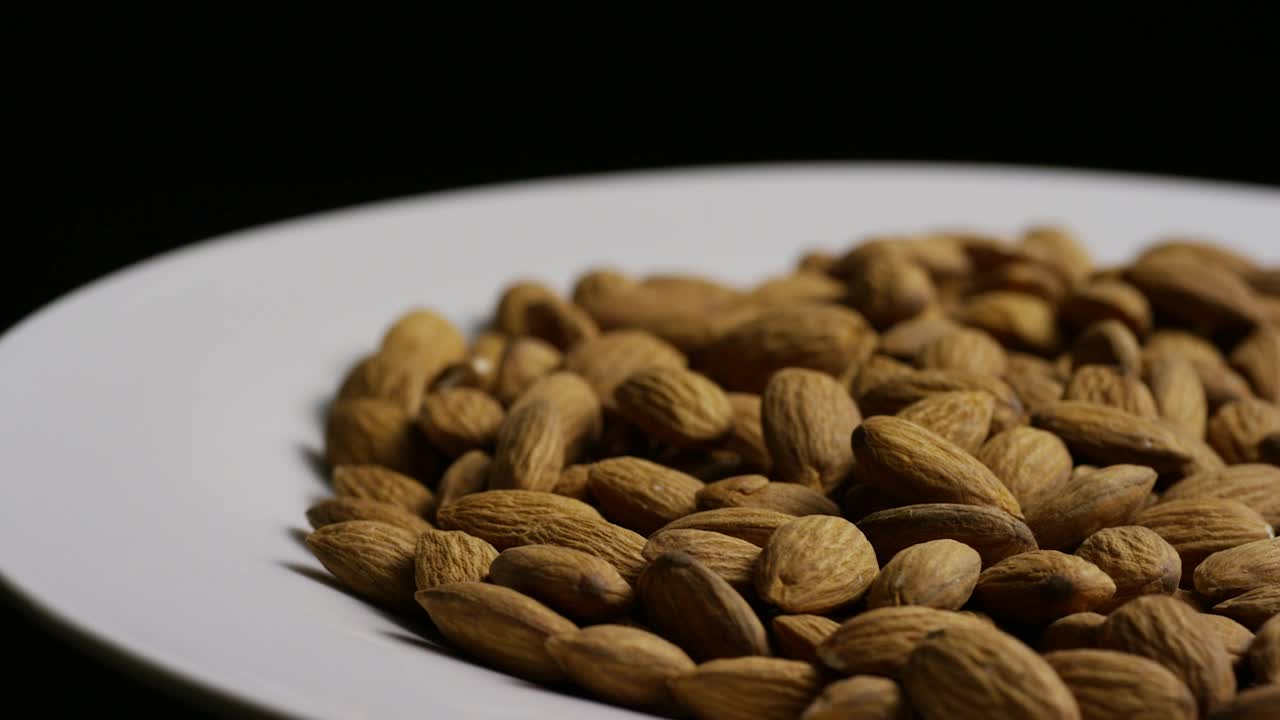 Download Stock Video Almonds On A Plate Rotating Live Wallpaper For PC