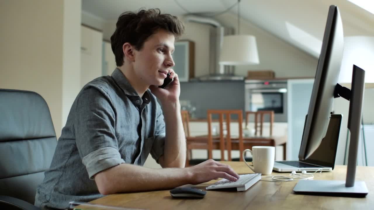 Download Stock Video A Young Man Talking On The Phone Working On The Live Wallpaper For PC