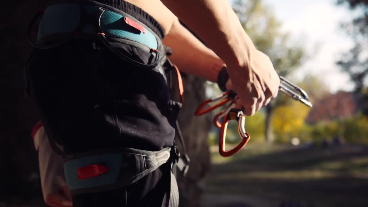 Download Stock Video A Young Man Preparing The Climbing Gear Live Wallpaper For PC