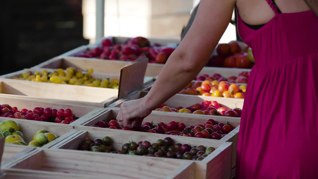 Download Stock Video A Woman Choosing Fruit At A Market Live Wallpaper For PC