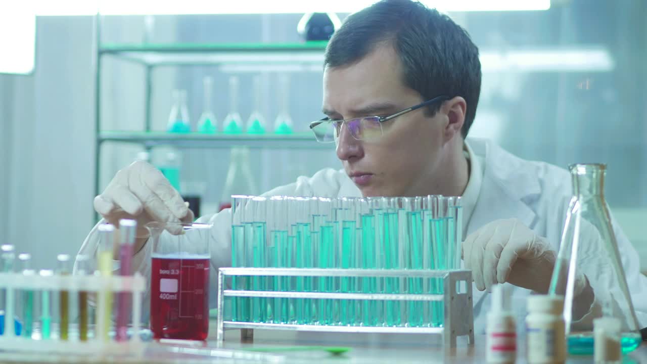 Download Stock Video A Scientist Experimenting With Tubes On The Lab Live Wallpaper For PC