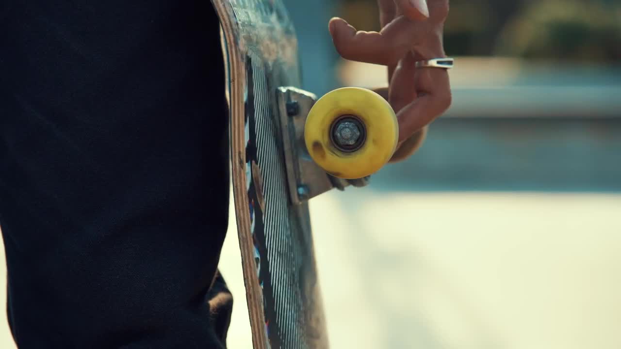 Download Stock Video A Person Spins The Wheel Of A Skateboard With His Live Wallpaper For PC