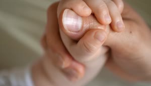 Download Stock Video A Mothers Hand Holding Her Babys Live Wallpaper For PC