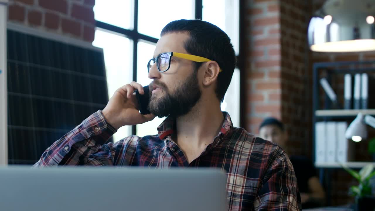 Download Stock Video A Man With Glasses Speaking On The Phone Live Wallpaper For PC