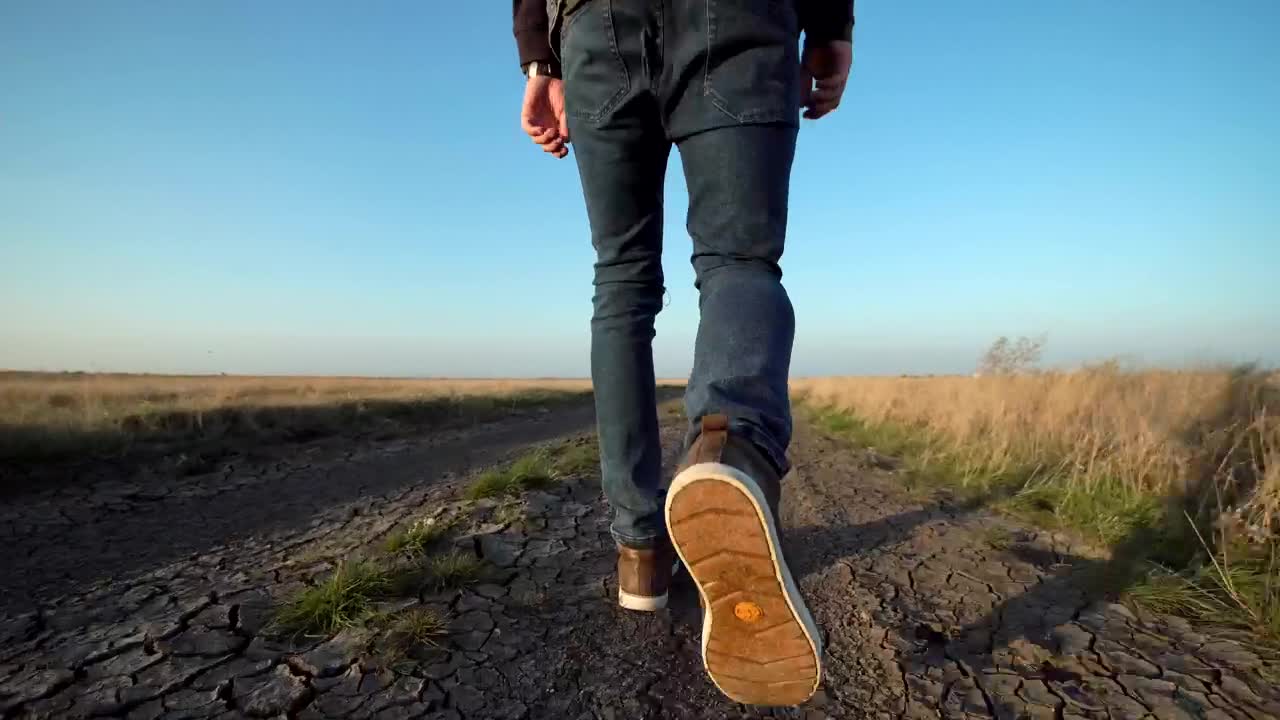 Download Stock Video A Man Walking On A Dirt Road Live Wallpaper For PC