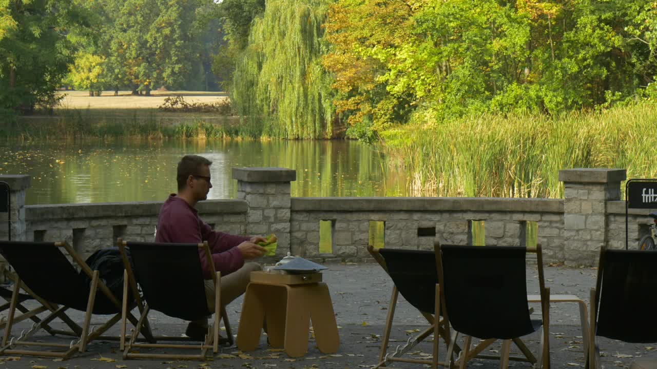 Download Stock Video A Man Leaves The Terrace By The Lake Live Wallpaper For PC