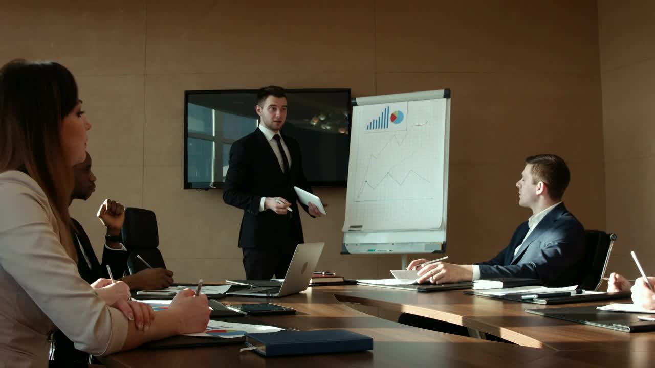 Download Stock Video A Man Is Presenting A Business Report Live Wallpaper For PC