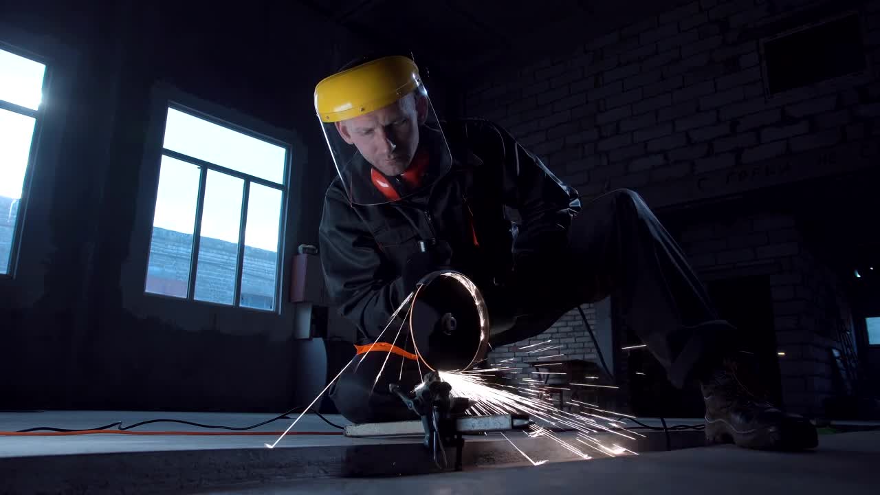 Download Stock Video A Man Cutting Metal With Machine Live Wallpaper For PC