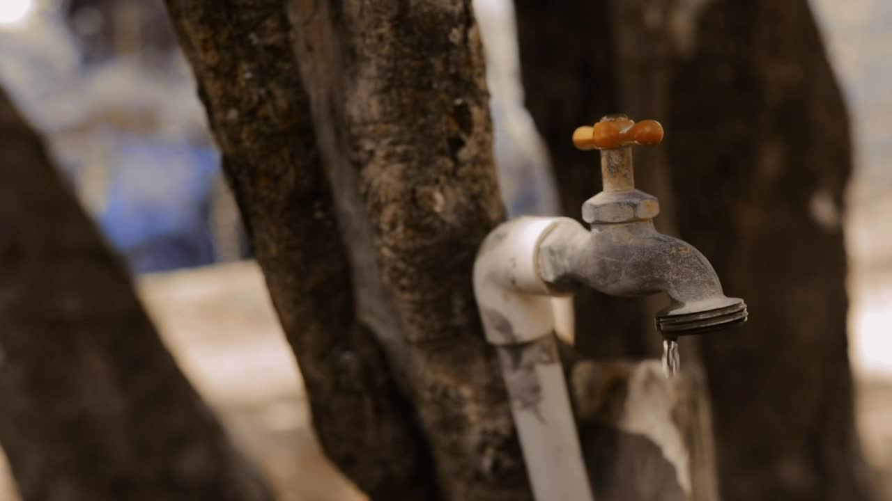 Download Stock Video A Man Closing A Faucet That Drips Closeup Live Wallpaper For PC