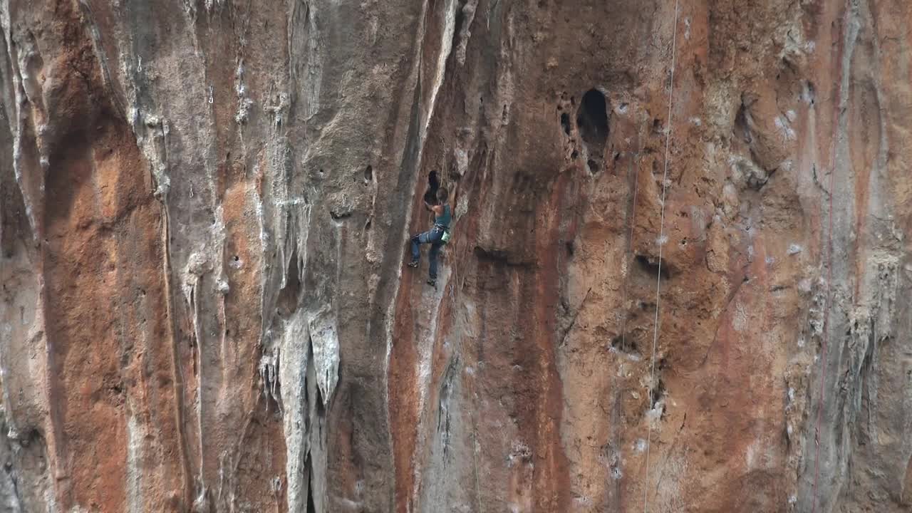 Download Stock Video A Man Climbing A Cliff Live Wallpaper For PC