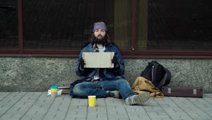 Download Stock Video A Homeless Guy Holding A Sign Live Wallpaper For PC