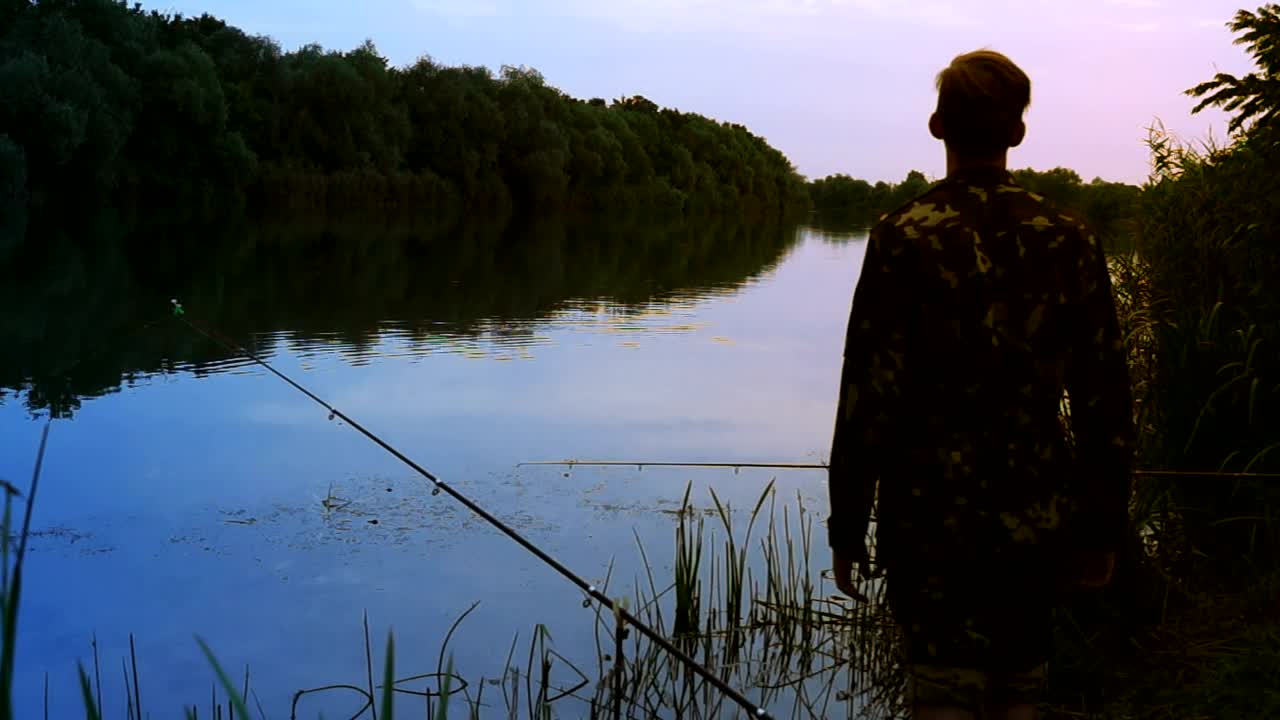 Download Stock Video A Fisherman Stands On The Riverside Live Wallpaper For PC