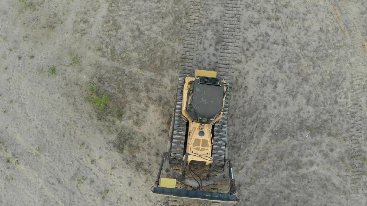 Download Stock Video Bulldozer Driving Through A Dirt Field Live Wallpaper For PC