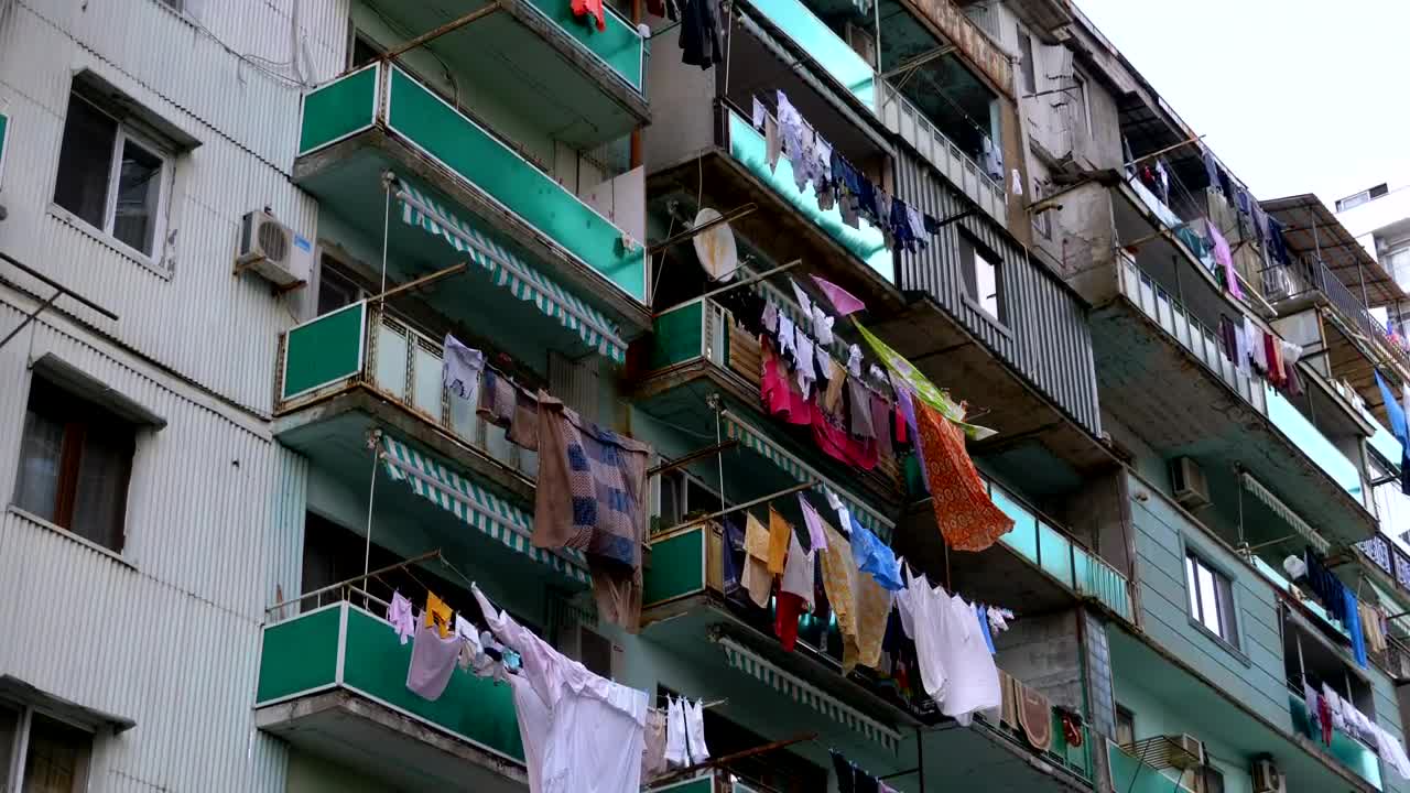 Download Stock Video Building With Clothes Hanging In The Balcony Live Wallpaper For PC