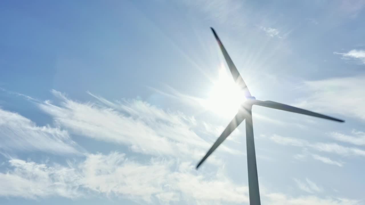 Download Stock Video Bright Sunshine Behind A Wind Turbine Live Wallpaper For PC