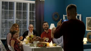 Download Stock Video Boy Takes A Photo Of Family In Thanksgiving Dinner Live Wallpaper For PC