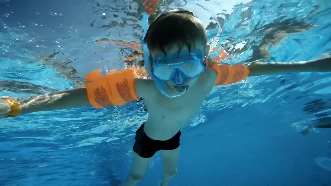 Download Stock Video Boy Swimming In The Pool And Saying Hi Live Wallpaper For PC