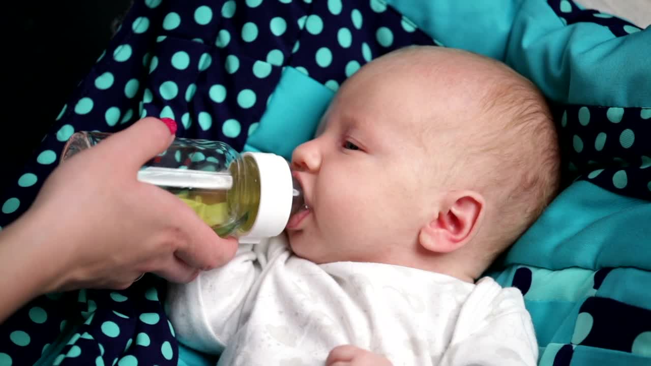 Download Stock Video Bottle Feeding A Young Baby Live Wallpaper For PC