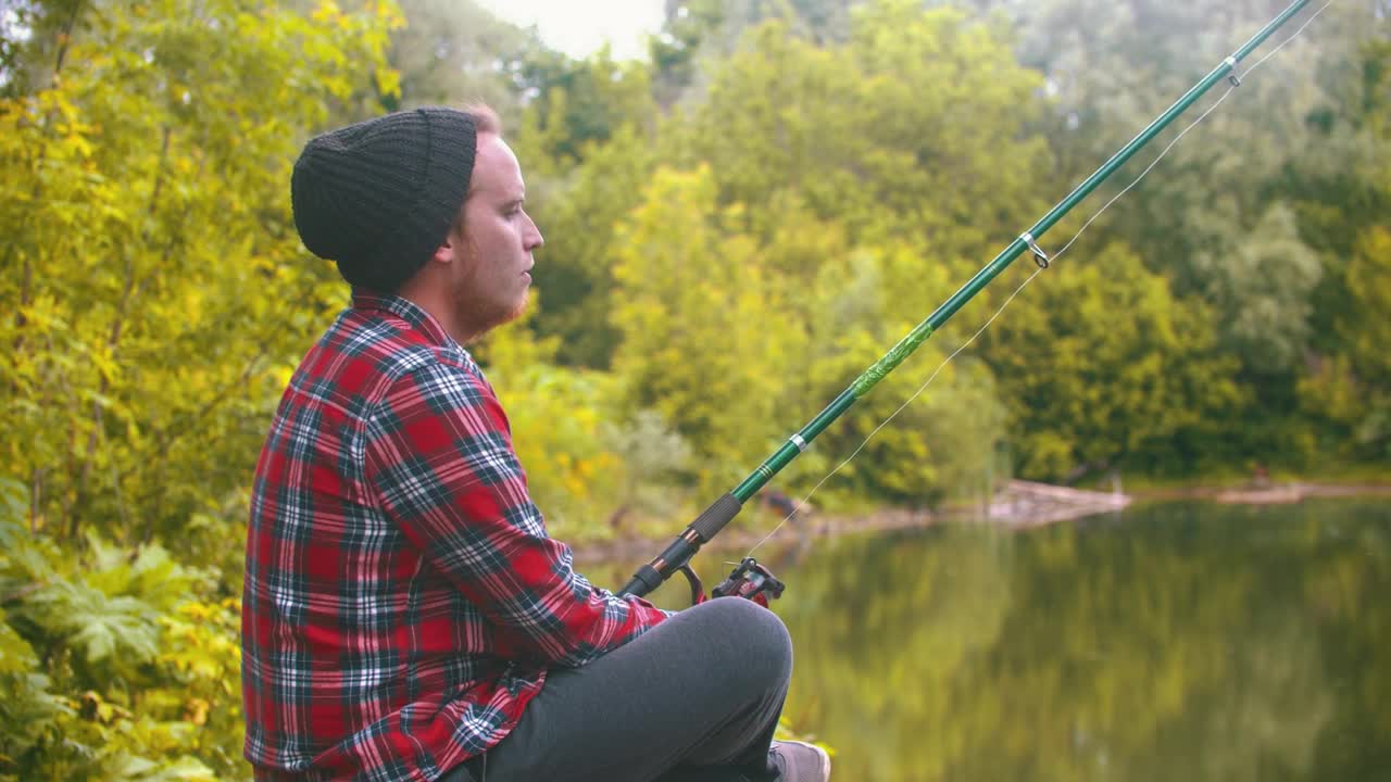 Download Stock Video Bored Young Man Fishing In The Forest Live Wallpaper For PC