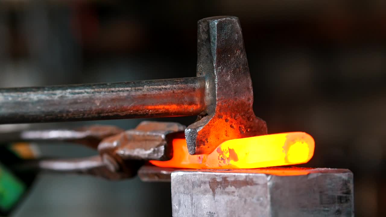 Download Stock Video Blacksmith Working On A Piece Incandescent Metal Live Wallpaper For PC