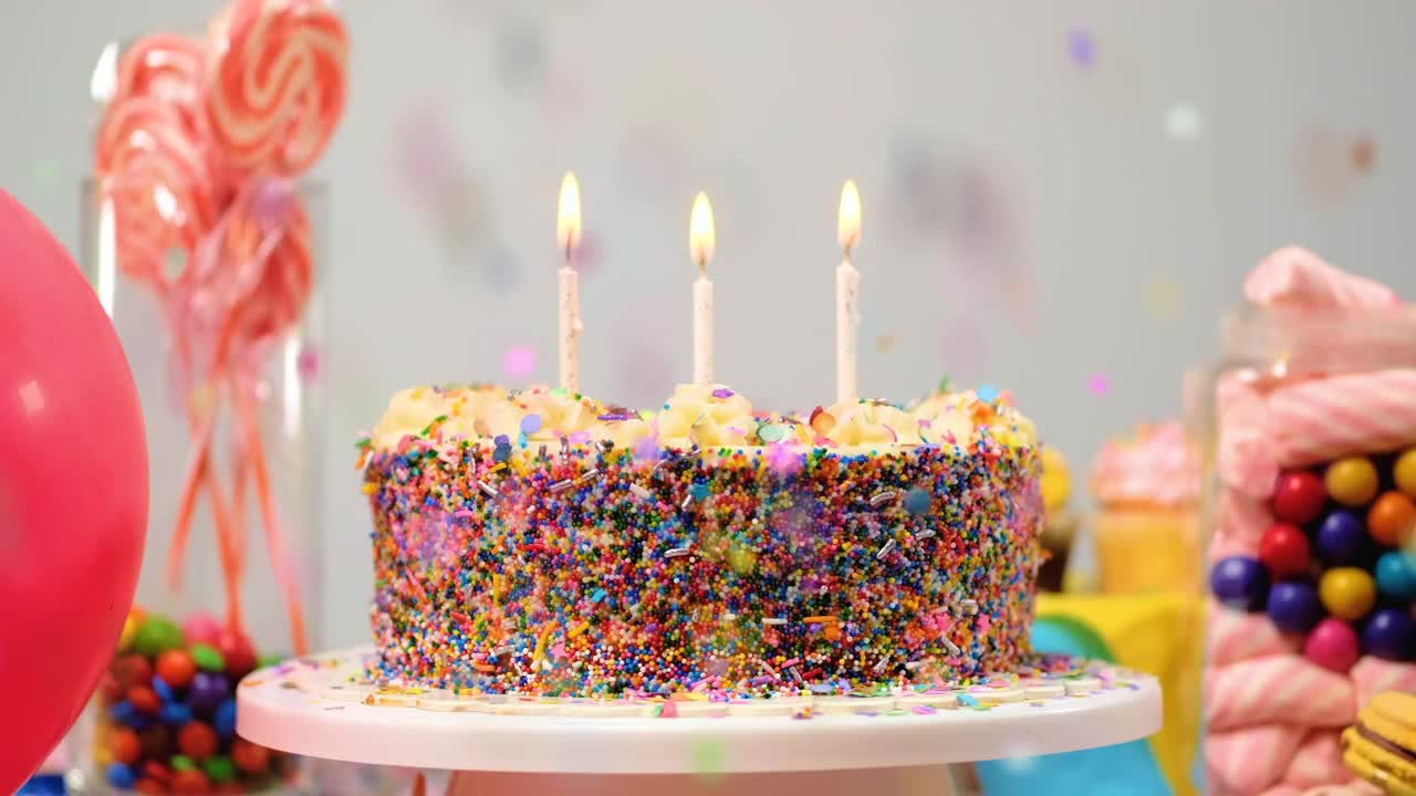 Download Stock Video Birthday Cake On A Table With Candies And Balloons Live Wallpaper For PC