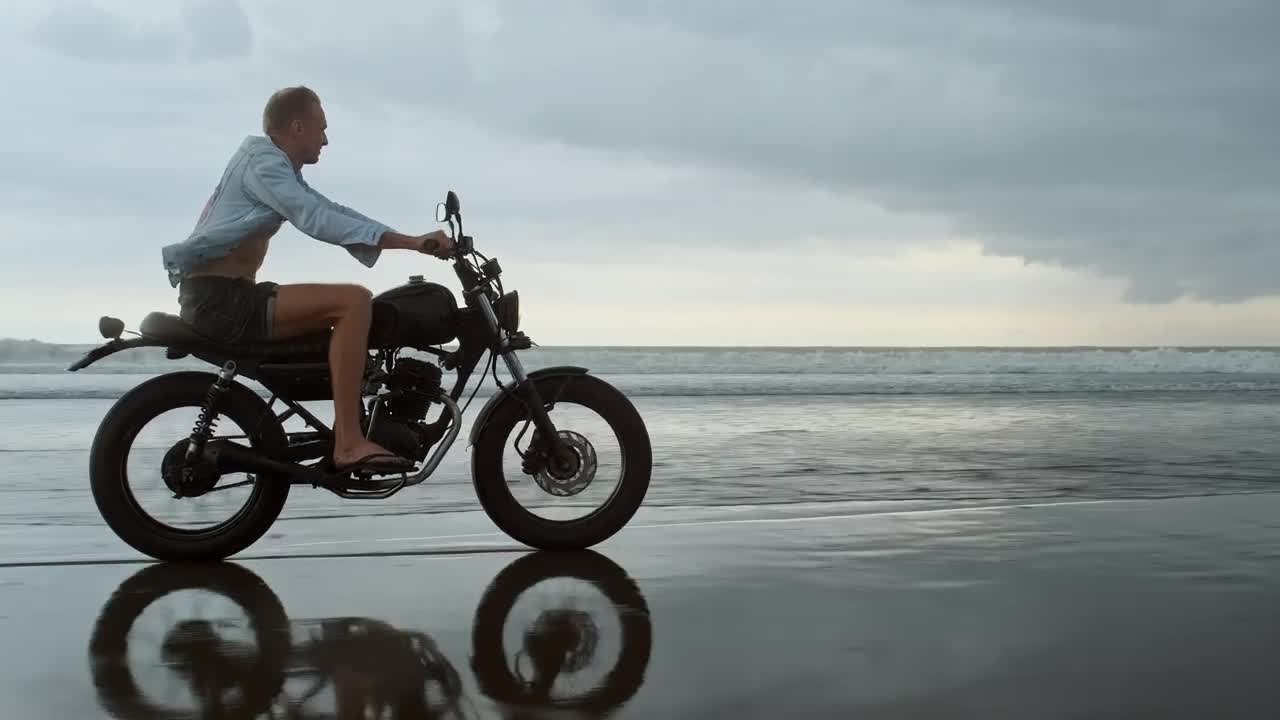 Download Stock Video Biker Riding On The Beach Live Wallpaper For PC