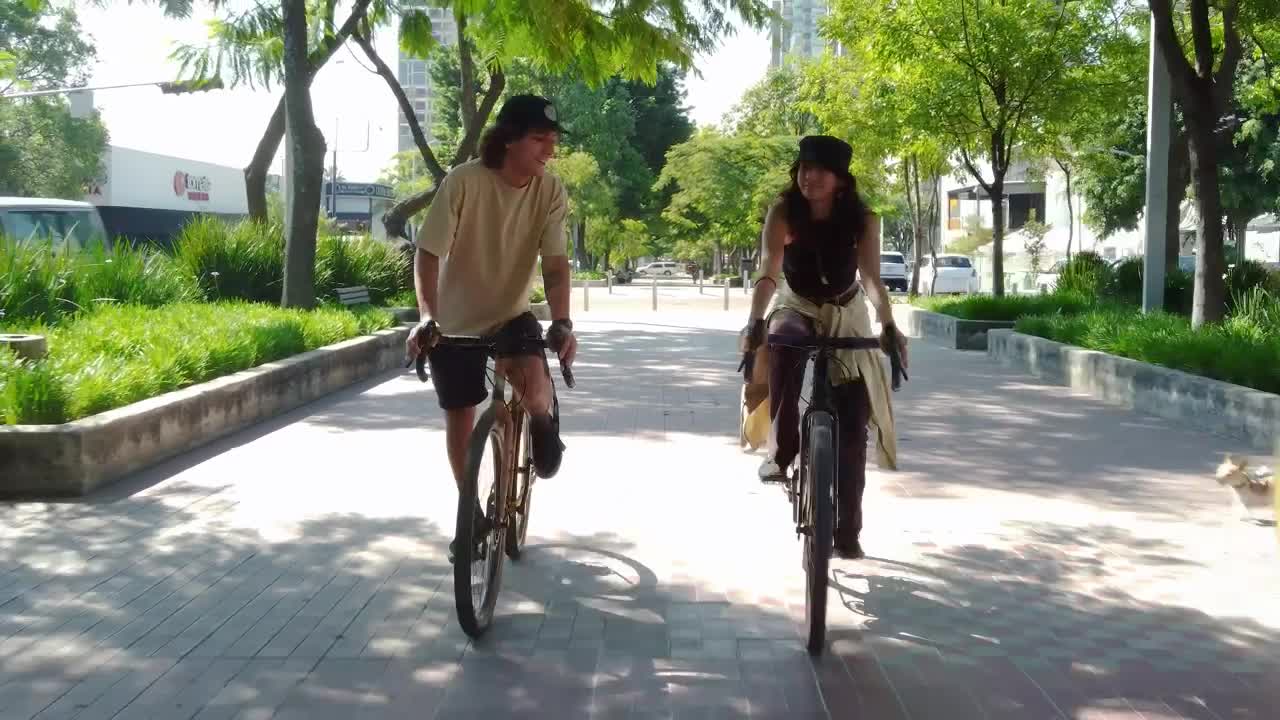 Download Stock Video Bike Ride Of A Couple Through A City Park Live Wallpaper For PC