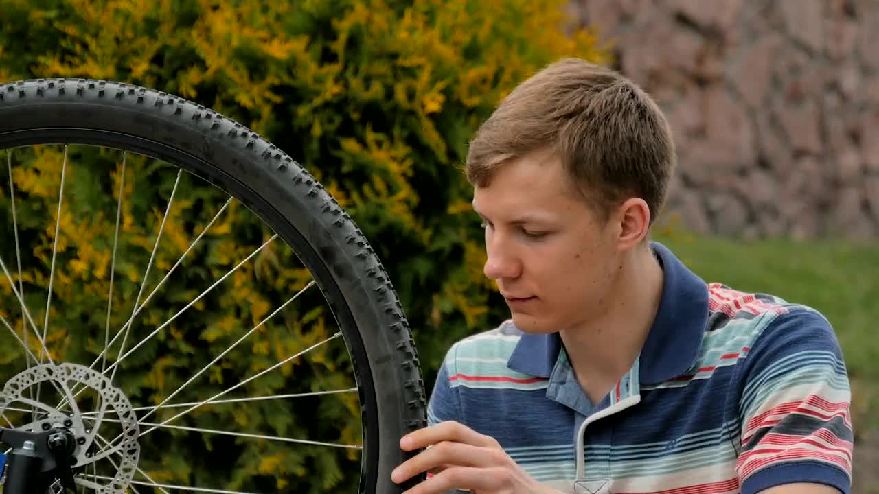 Download Stock Video Bike Repair Man Spins Wheel And Gives Ok Live Wallpaper For PC