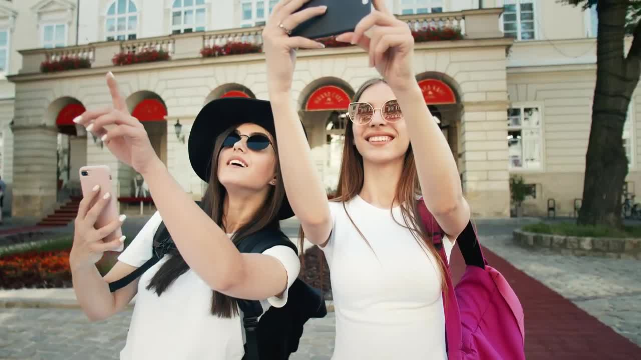 Download Stock Video Beautiful Tourists Pose For Social Media In European Town Live Wallpaper For PC