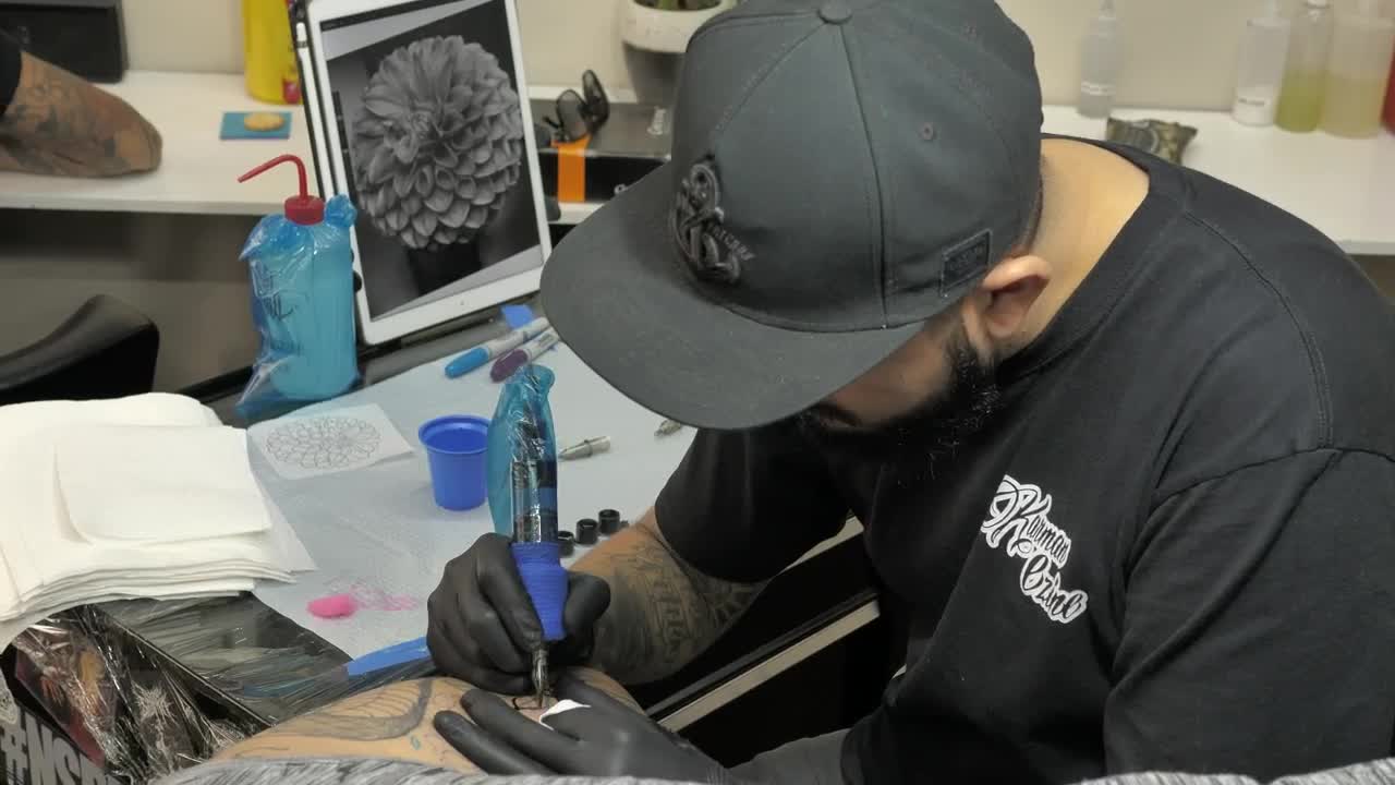 Download Stock Video Bearded Tattooist Making A Flower Live Wallpaper For PC