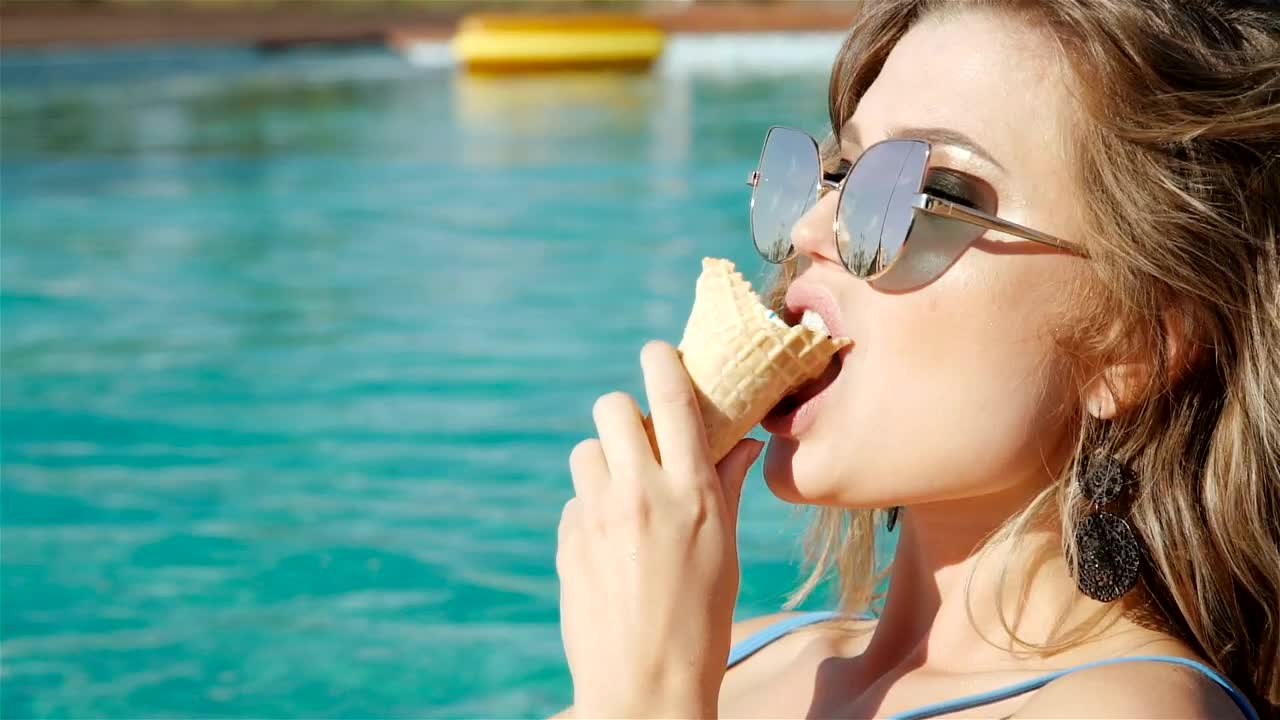 Download Video Stock Closeup Of Woman Eating Ice Cream In Swimsuit Live Wallpaper For PC