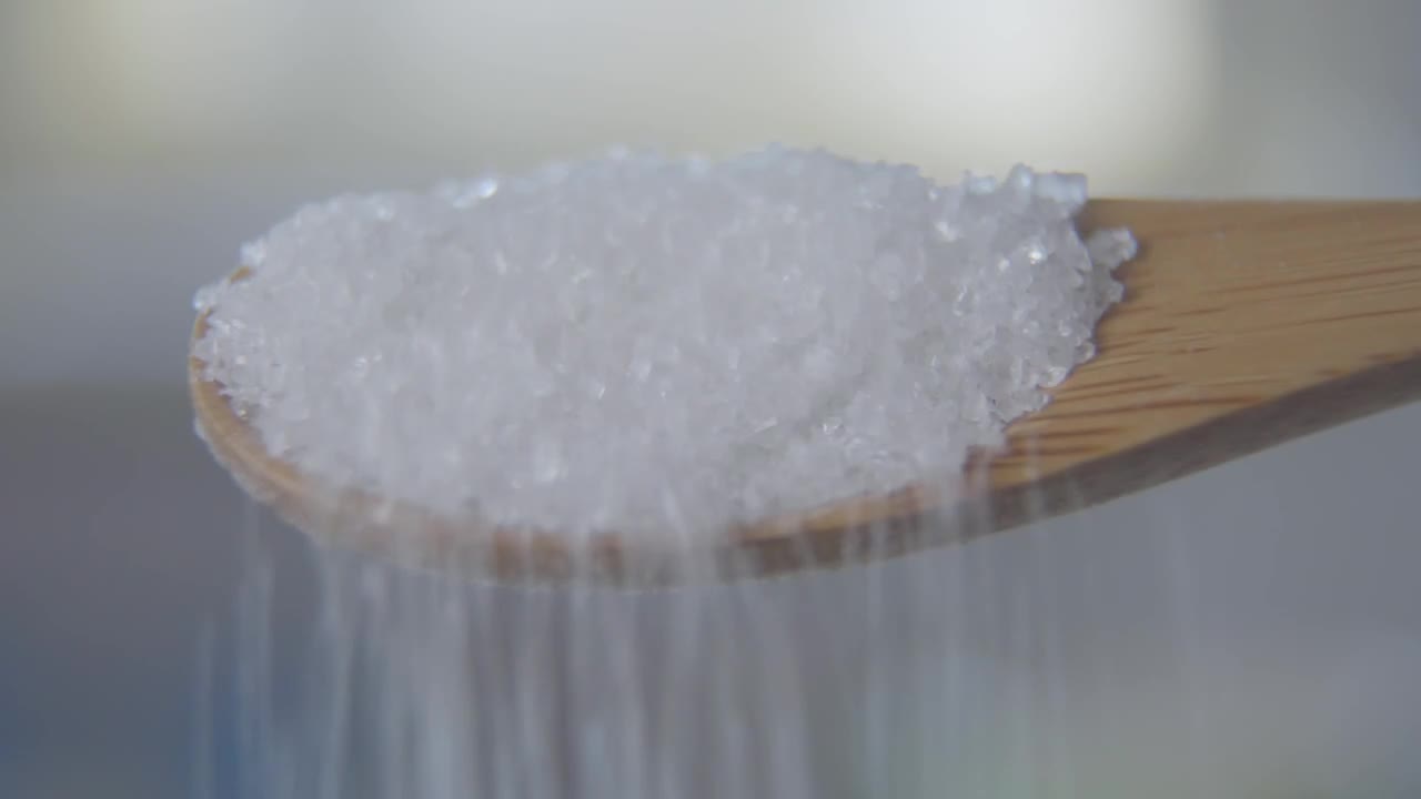 Download Video Stock Closeup Of Sugar Spilling From Wooden Spoon Live Wallpaper For PC